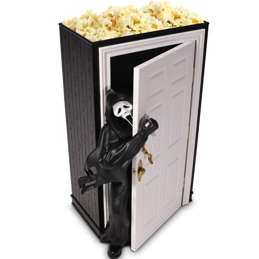 Halloween prop a black coffin with a skeleton reaching out popcorn piled on top for a spooky display