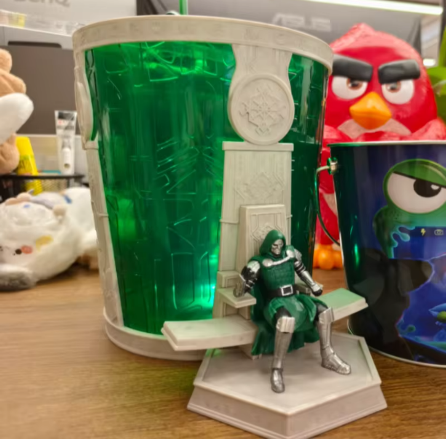 Fake Doctor Doom throne cup with a green see through cup and a Doom figure on a gray throne from an AliExpress listing