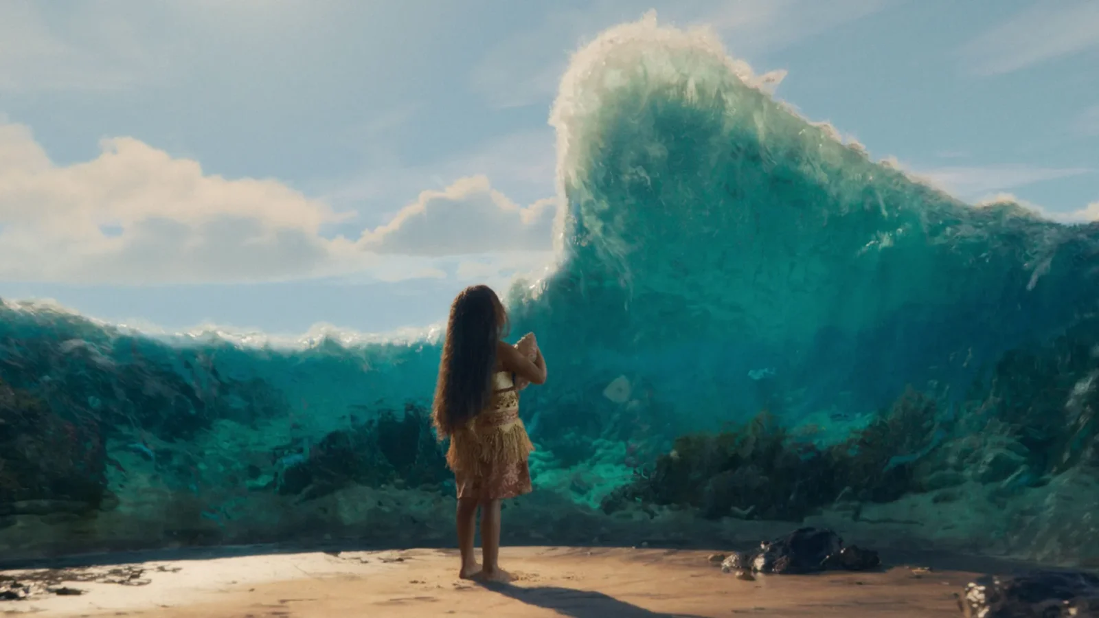 Girl in a light dress stands on a sandy beach barefoot watching a colossal turquoise wave curling toward her under a blue sky