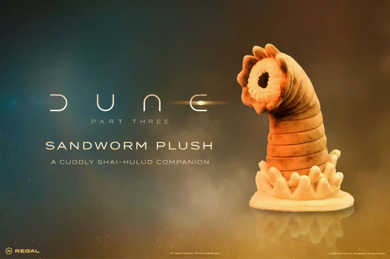 Promotional poster for Dune Part Three featuring a sandworm plush on the right and the text Sandworm Plush with the tagline A cuddly Shai Hulud companion on the left runway style gradient background