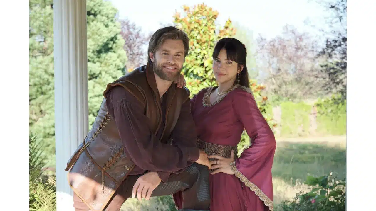 ktr2 Fantasy Land News Man and woman in period costumes pose together on a porch smiling at the camera in a sunny garden backdrop